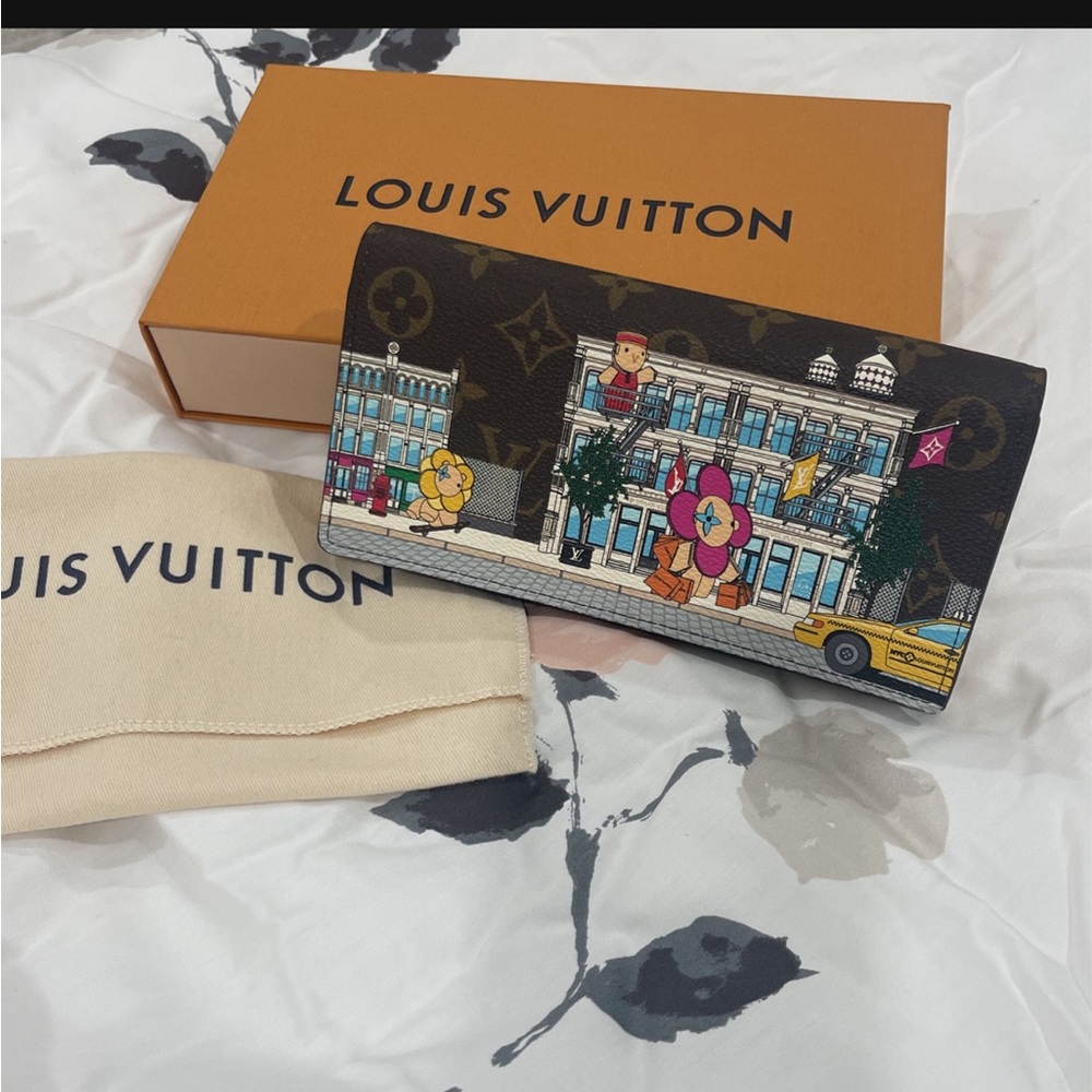 Authentic Louis Vuitton Sarah wallet animation, never used.